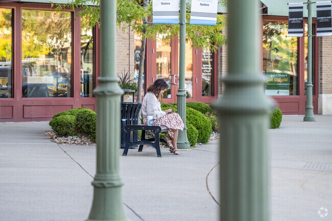 A young lady takes a break at Suncrest Towne Center near Wiles Hill-Highland Park.