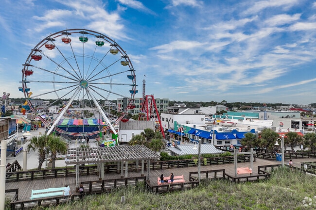 Families love hanging out at Carolina Beach, just a short drive from The Cape.
