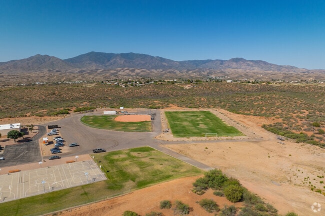 A well-maintained field adjacent to the school provides space for physical education, team sports, and school-wide events.