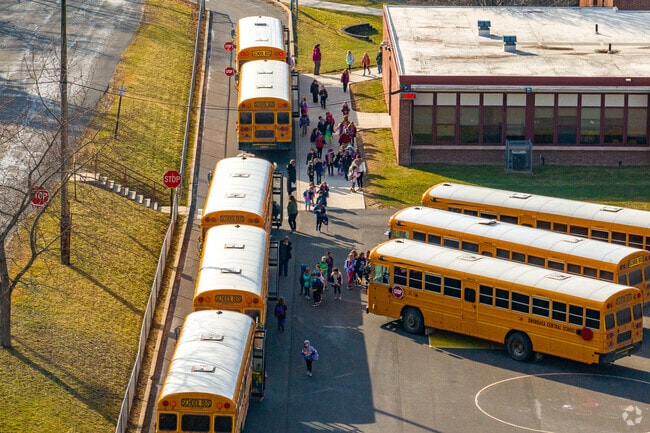 Students line up to get on the bus and go home at Rockwell Elementary in Nedrow.