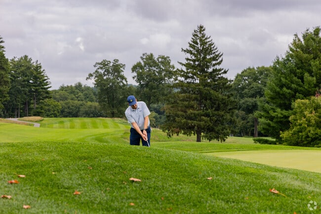 A golfer tees up at the Nashua Country Club located in the South End of Nashua.