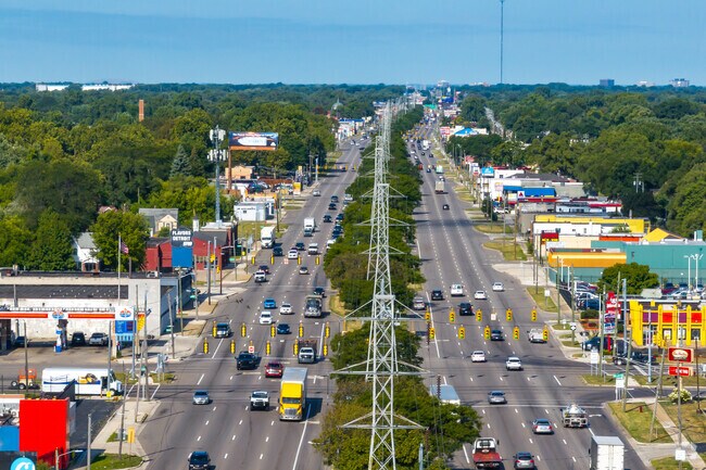 Shops line 8 Mile Road near Sherwood.