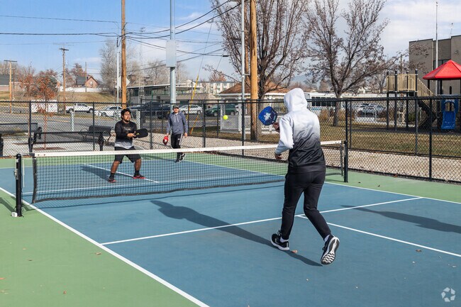 Friends play pickle ball at Murray Park in Murray.