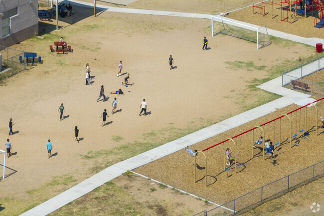 Students of Mayer Elementary School play a game of soccer during recess.