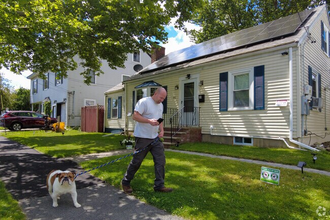 Dog walkers enjoy the many shaded streets within Austin Square.