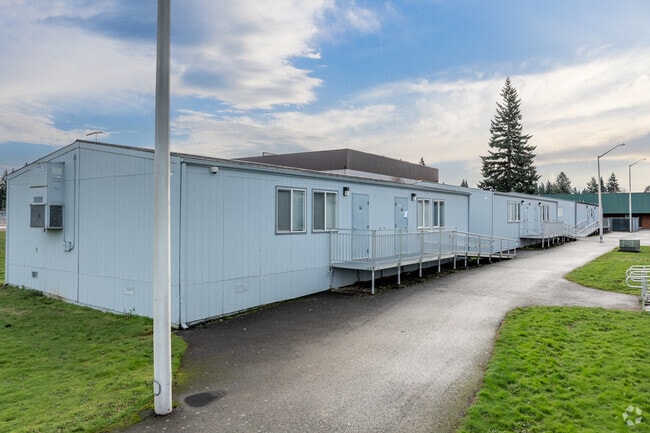 A row of portable classrooms sits behind Evergreen High School in Vancouver, WA.