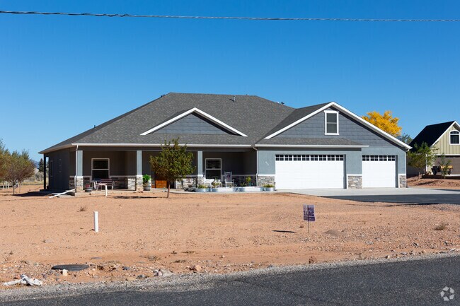 Modern single-story homes in Parowan feature spacious garages and desert landscaping.