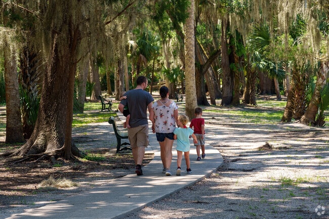 A Plantation Estates family relishes a stroll at Gemini Springs Park.