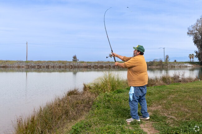 A McFarland resident enjoys the fishing at Lake Woollomes.
