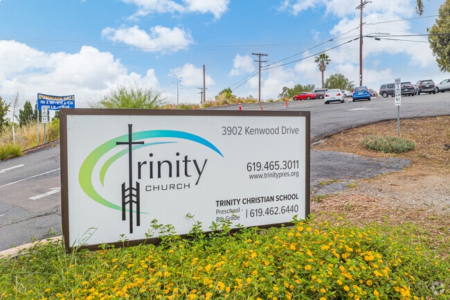 The sign shows the logo for Trinity Christian School in Spring Valley, CA.