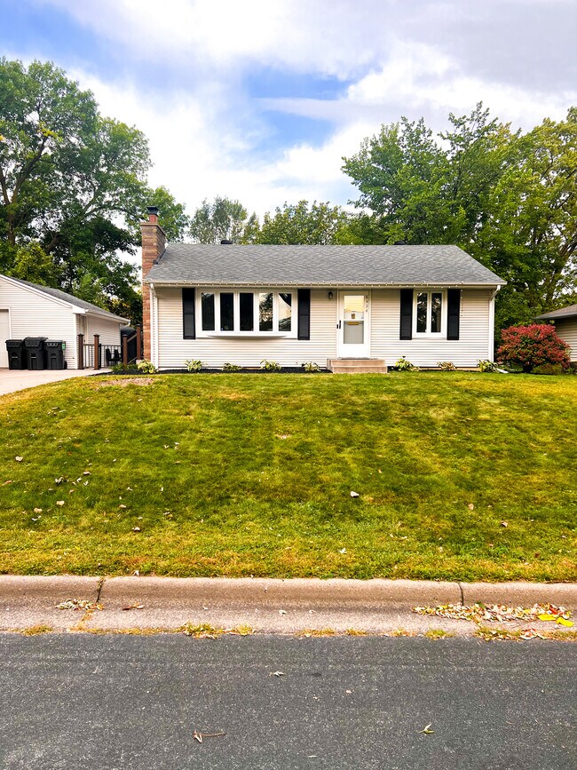House Front View (new landscaping & storm shutters)