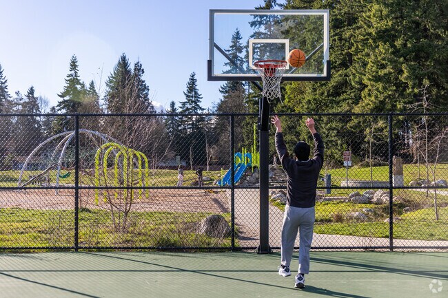 Yost Park has a basketball court, dog area, trails, and a playground.