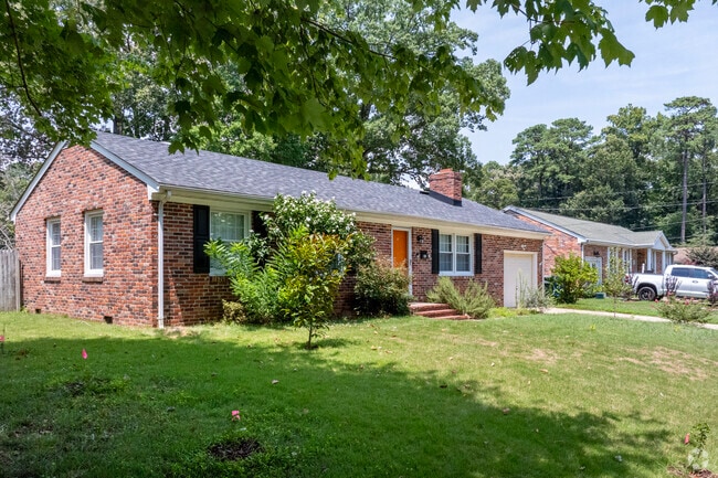 Brick Ranch homes with tidy front yards line the streets of the Saunders neighborhood.