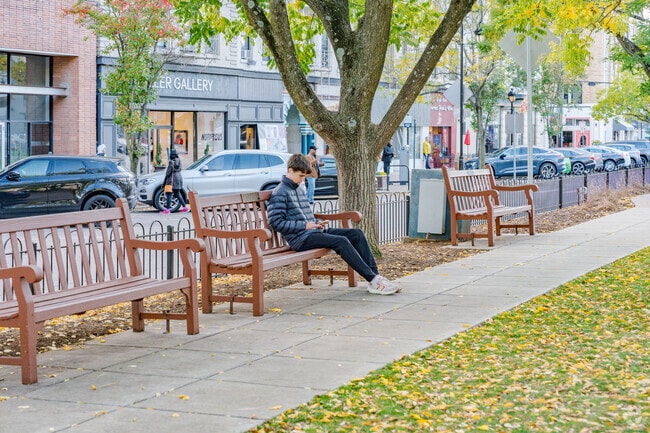 Residents of Hyde Park enjoy relaxing on one of the many benches around the square.