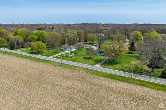 Many homes in Millburg have large lawns with mature trees.
