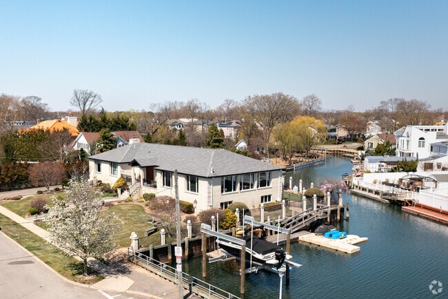 Many large hi ranch style homes along the numerous canals of Merrick have  boat slips for residents to dock their boats.