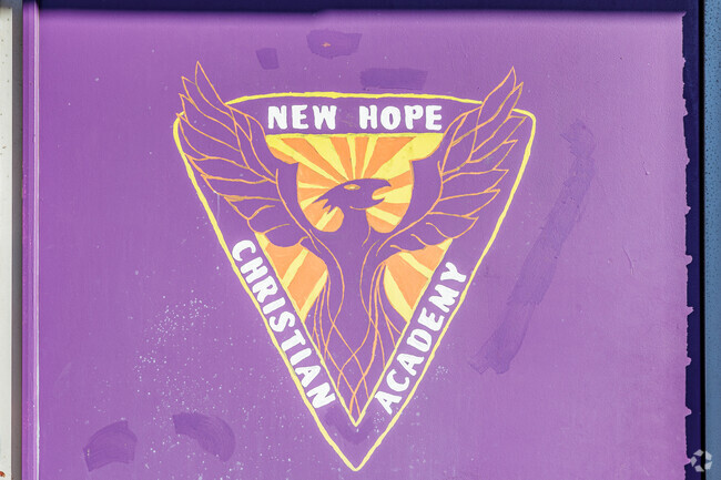 The logo of New Hope Christian Academy features a Phoenix.