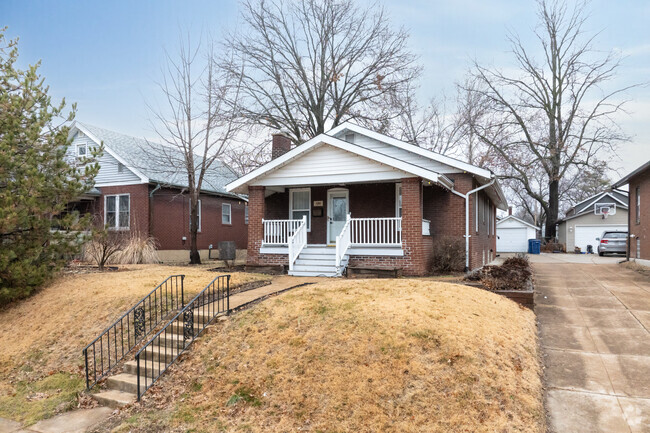 A brick bungalow sits pretty atop a hill in Maplewood.