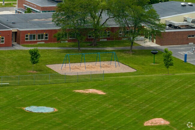 Raymond C. Buckley Elementary School also features swings for students to play on.
