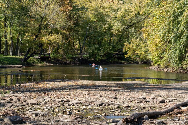 Kayakers enjoy paddling the Cuyahoga River through Water Works Park in Cuyahoga Falls, Ohio.