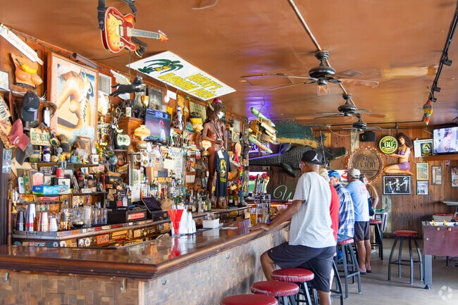 Sunset Ridge locals enjoying drinks and friendships at the bar at Harry's Banana Farm.