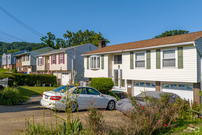 Some bi-level homes feature 2 garages for either extra space or storage in Chartiers.