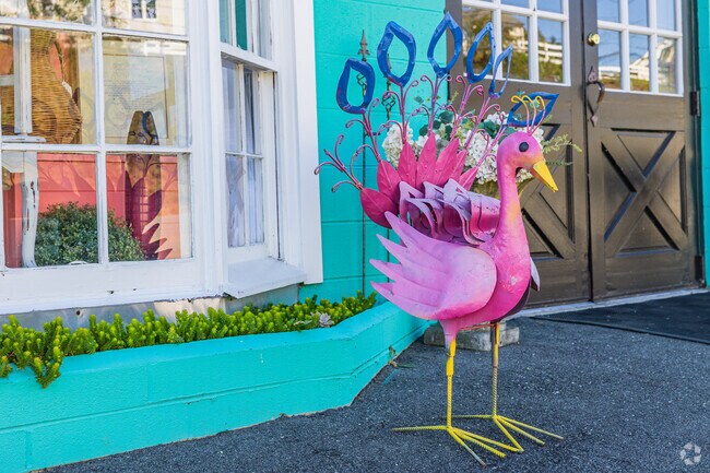 A vibrant yard ornament adds charm to a storefront in Harmony Grown-Town Center.