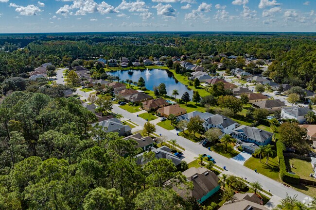Near a lake and surrounded by trees Moultrie residents enjoy privacy and water views.