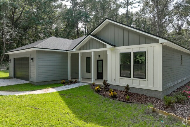 Custom-built ranch-style home in Midway includes an attached garage.
