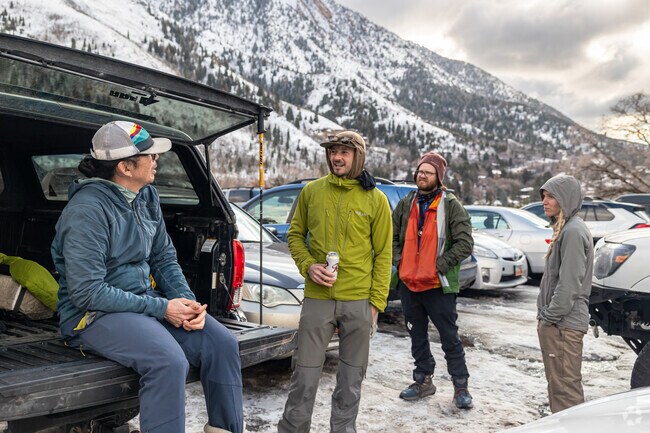 Hikers hang out in the parking lot after hiking in Mount Olympus.