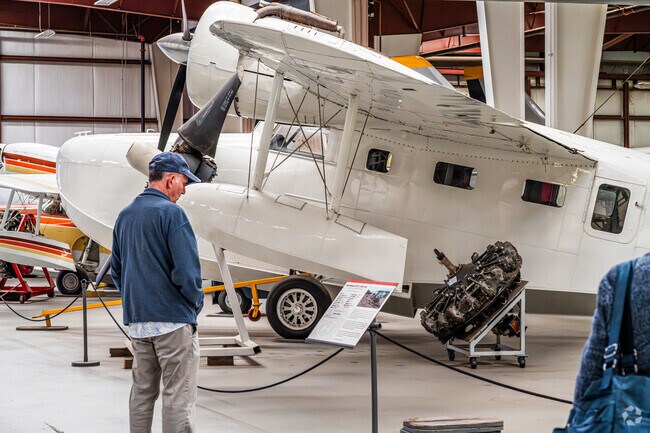 A visitor at Yanks Air Museum in College Park reads the history on these amazing aircrafts.