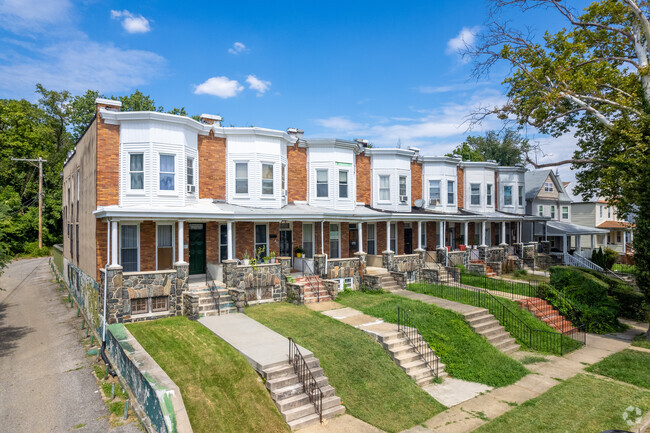 Many of the rowhomes in Garwyn Oaks have large bay windows on their upper floors.