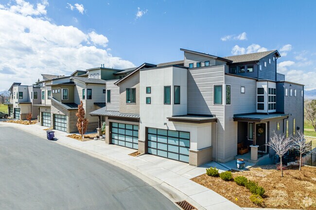 Modern townhomes near Willis Case Golf Course feature multi-car garages.