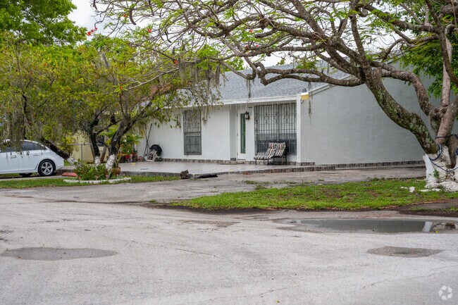 Updated single family home in Vista Verde with lush trees.