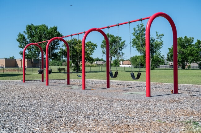 Mackleman Park's swings are ready for Oakcliff-Parkview children to play on.