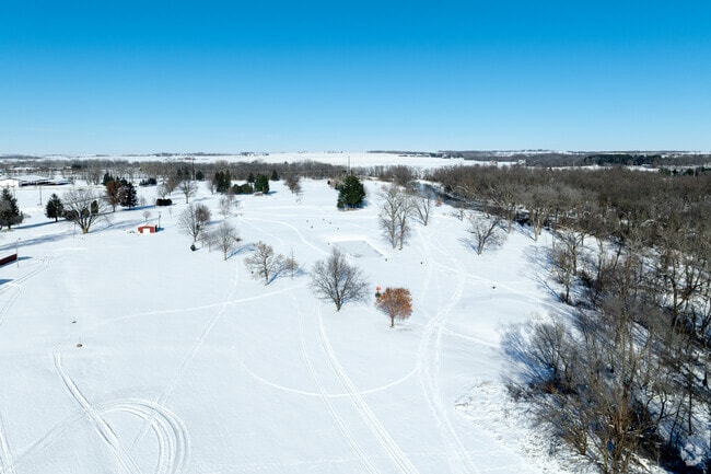 Johnson Park in Monticello features open fields and shaded picnic areas for gatherings.