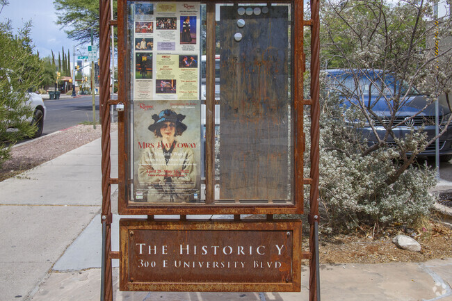 A sign for the Paolo Freire School is creatively displayed in front of the building.