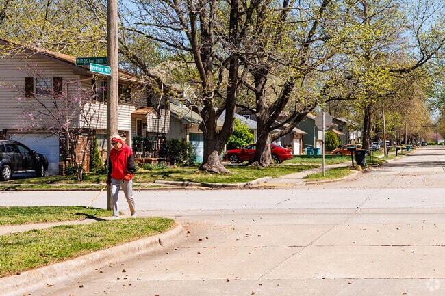 Meador Park is a quiet place where residents enjoy a walk on a residential sidewalk.