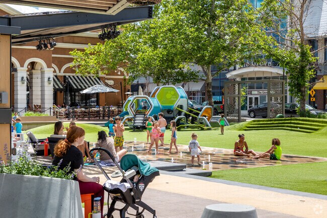 Sit and relax in the shade while the kids play at the playground at Zona Rosa Shopping Center.