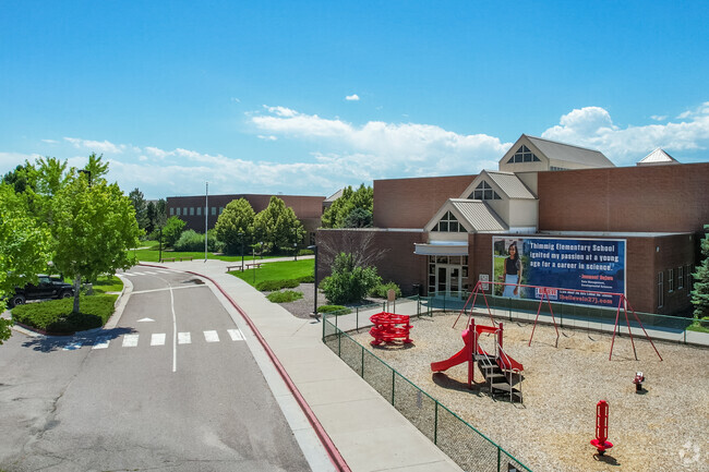 The drop-off lane and playground at Thimmig Elementary School in Henderson, Colorado.
