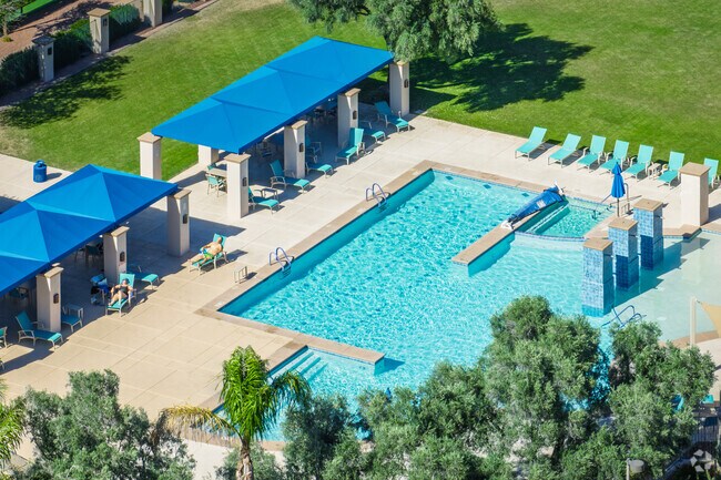 Residents relax by the pool at The Village Center in Continental Ranch Sunflower.
