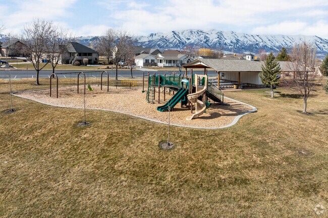 Nibley parents can watch their kids play from a covered pavilion at Virgil Gibbons Heritage Park.