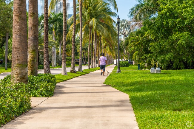 Many Golden Beach residents take advantage of private living by walking their dogs.