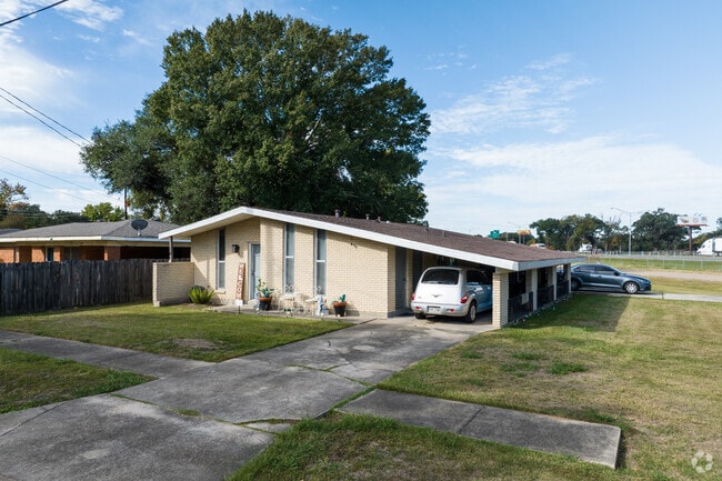 This is another great example of a Mid-Century home in Evangeline with an attached carport.