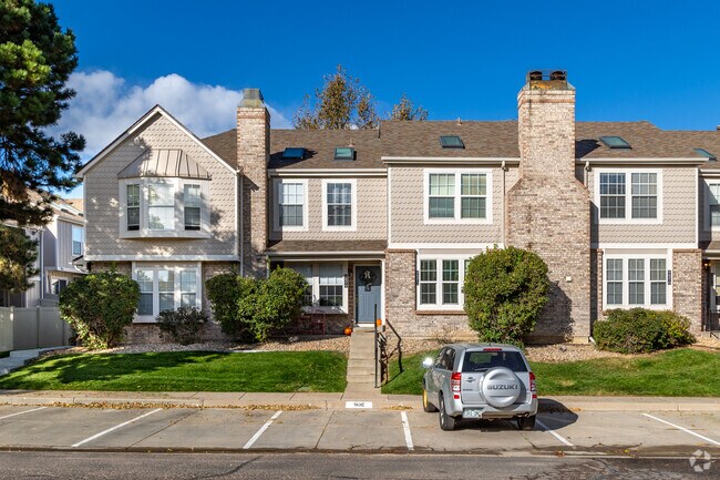 Townhome condos with pale siding and stone accents can be spotted in Charter.