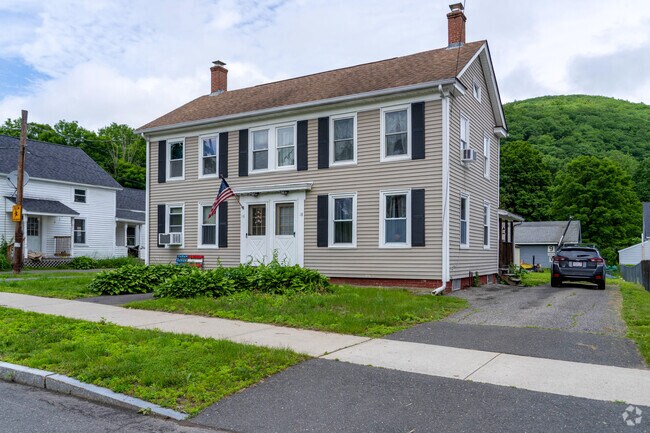 Chester features a colonial-style duplex that reflects the town’s mix of historic charm and multifamily housing.