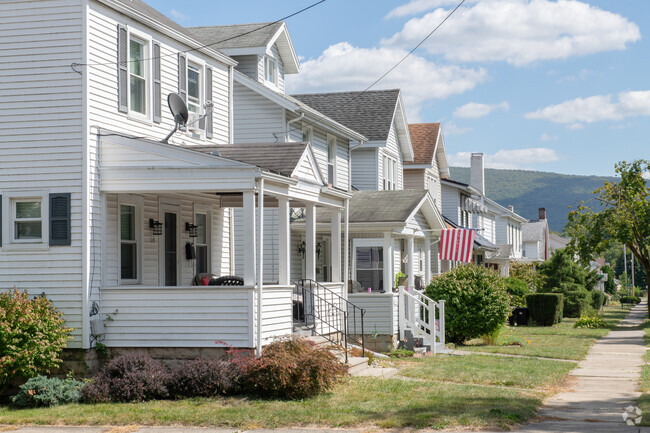 Neatly kept homes offer a pleasant sight in this row of Juniata neighborhood houses.