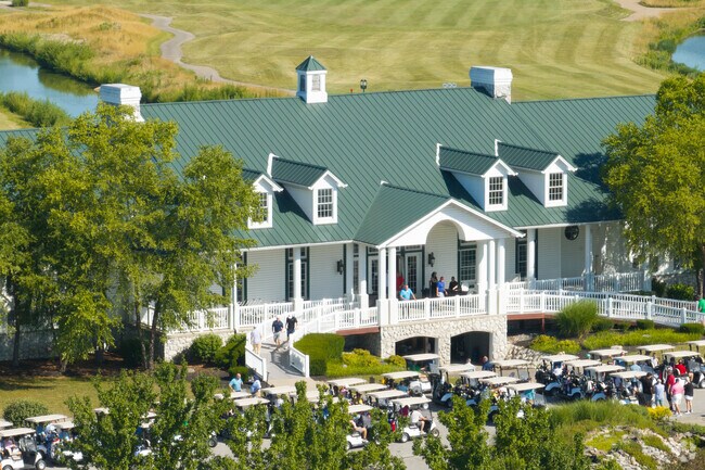 Players gather at Southern Dunes Golf Course for early tee times on a sunny Sunday.