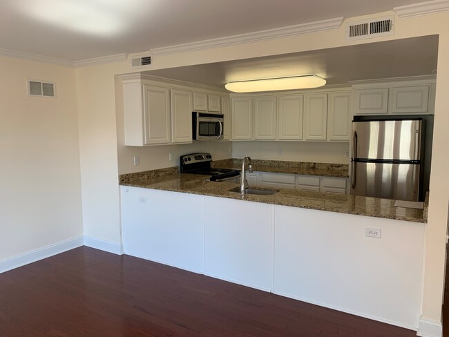 Kitchen opens to living space
