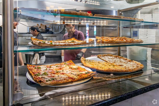 La Famiglia Pizzeria in Ivy Hill offer not just delectable slices but a warm community atmosphere where neighbors gather and friendships flourish.